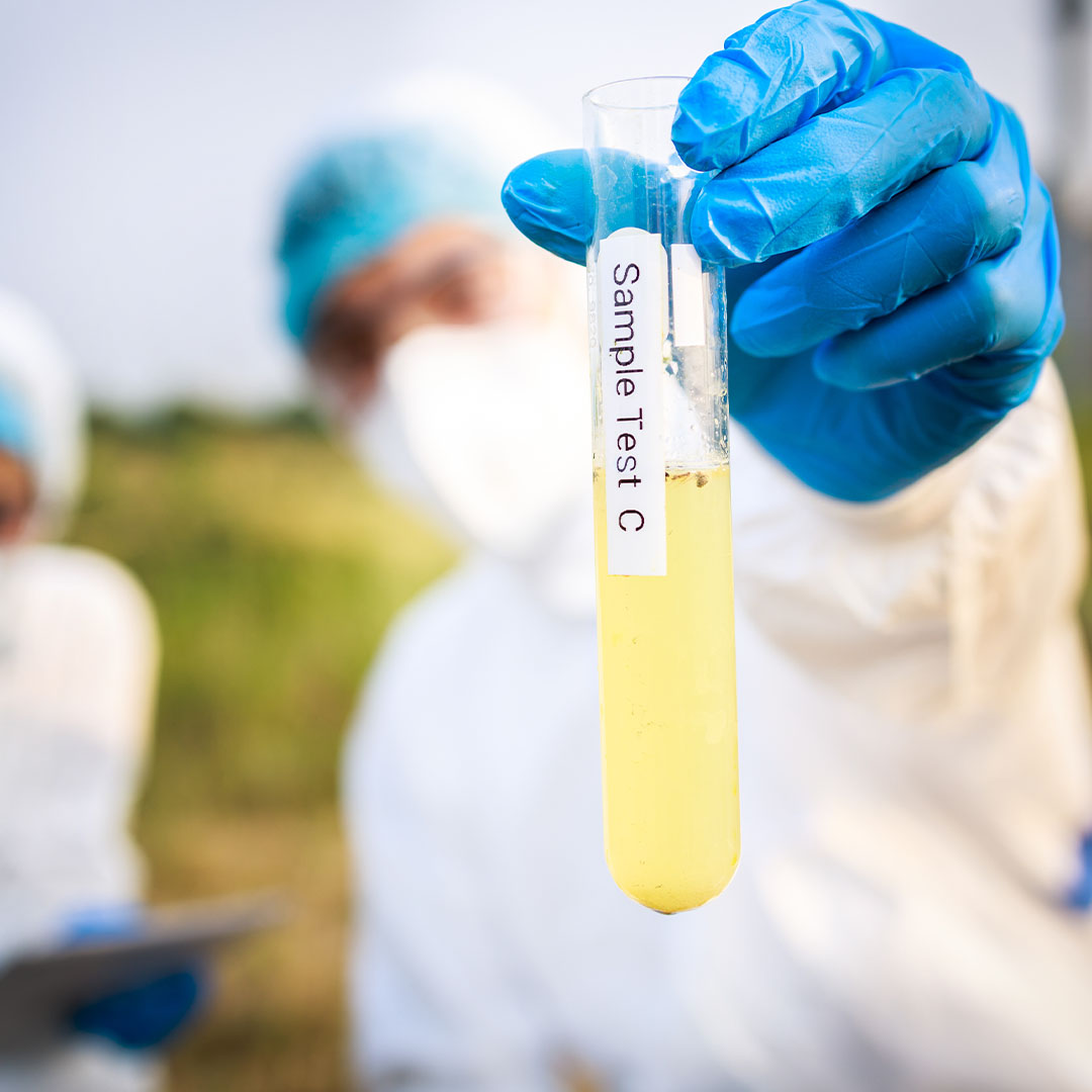 scientist examining sampling of toxic water 2