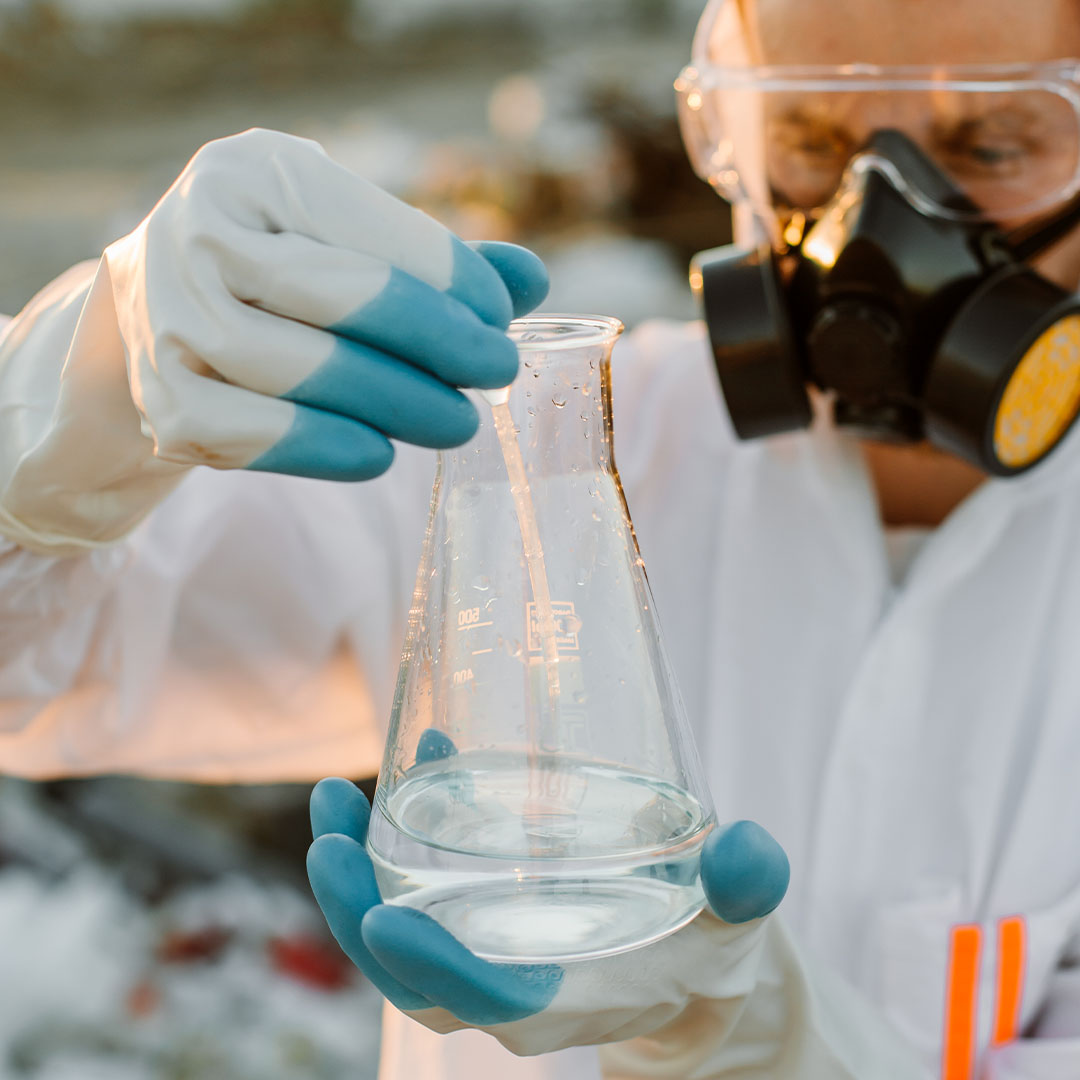 scientist examining sampling of toxic water